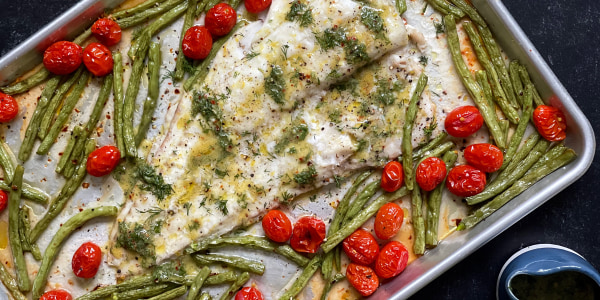 Plated fish with tomatoes and green beans