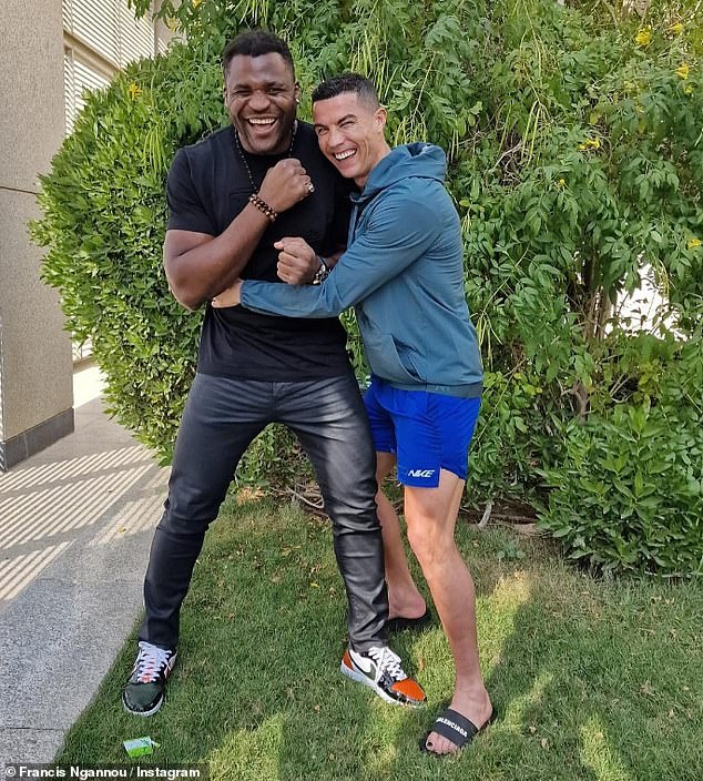 Fans have already noticed his big toe painted black in a photo with Francis Ngannou (left)