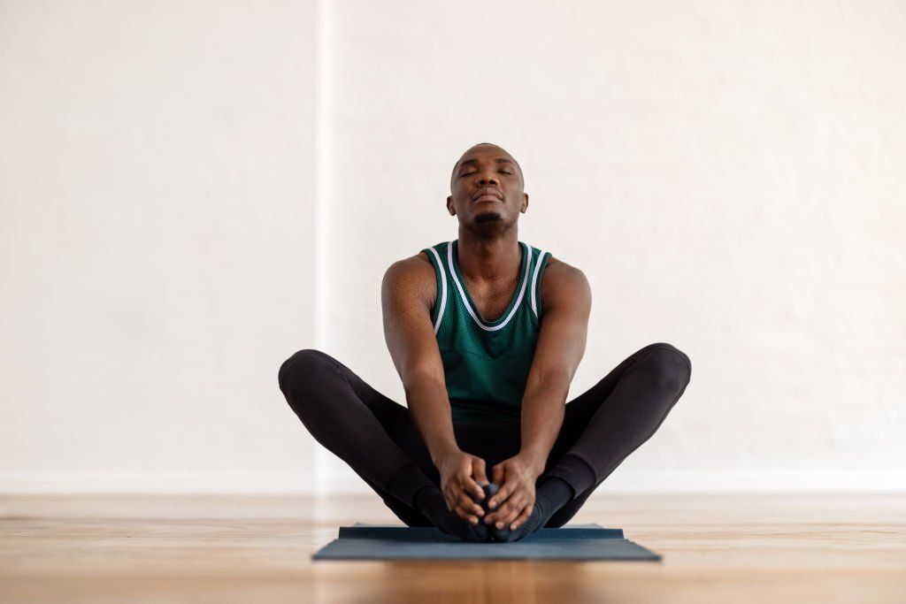 Join a yoga class or train on your own to reap its benefits (Image via Getty Images)